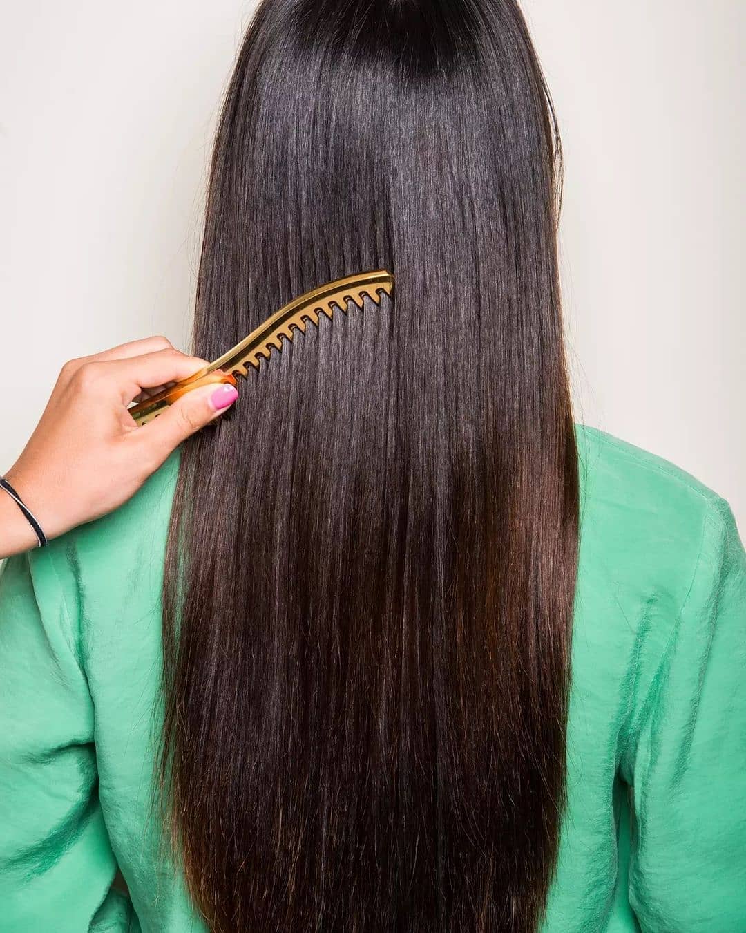 Wide tooth comb brushing gold
